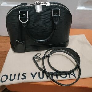 Authentic Louis Vuitton alma bb in epi noir (black with silver hardware).